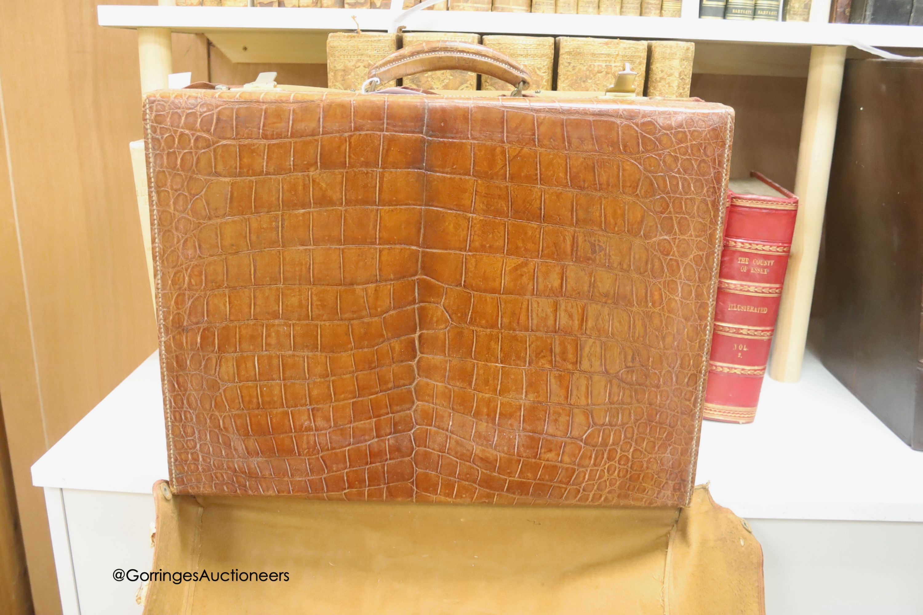 A Harrod's Limited crocodile skin case, width 50cm